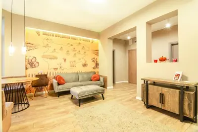 a living room with a couch and a table at 1 BR Wine Journey in Sofia
