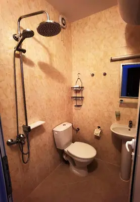 a bathroom with a toilet and a sink at Апартамент 204 Студенец in Pamporovo