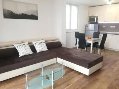 a living room with a couch and a table at Fashion Apartments in Sandanski