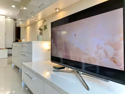 a large flat screen tv sitting on top of a table at Entire Apartment for 4 Guests in Sofia in Sofia