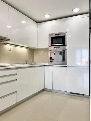 a kitchen with white cabinets and a microwave at Entire Apartment for 4 Guests in Sofia in Sofia