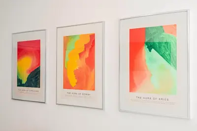 four framed art prints on a wall at BohoBox Studios in Plovdiv