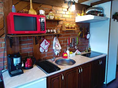 a kitchen counter with a sink and a microwave at Ethno art maisonette in the center of Sofia - plus Free Vouchers & Gift in Sofia