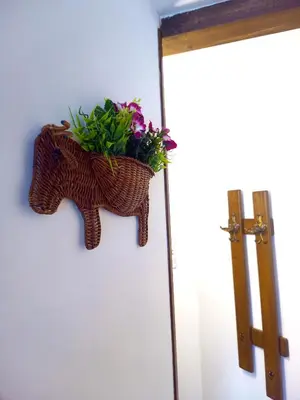 a basket of flowers hanging on a wall at Ethno art maisonette in the center of Sofia - plus Free Vouchers & Gift in Sofia