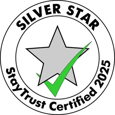 a star logo with a green arrow in a circle at Ethno art maisonette in the center of Sofia - plus Free Vouchers & Gift in Sofia