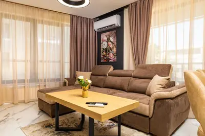 a living room with a couch and a table at Urban Lux Apartments Center of Plovdiv by Flat Mаnager in Plovdiv