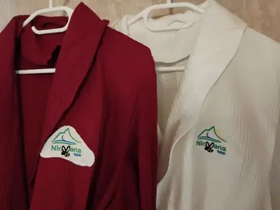 a group of shirts hanging on a rack at Pirin Golf - NIRVANA, Studio&SPA in Razlog