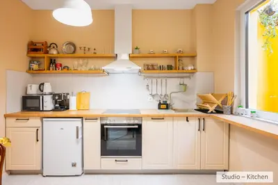 a kitchen with white appliances and a window at Super Central Stylish Suite & Studio with Shared Terrace by Flat Mаnager in Sofia