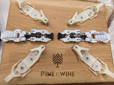 a cake with guns on top of a wooden table at Pine & Wine Sauna Apartment in Pamporovo