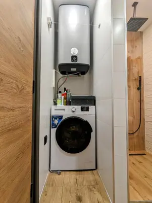 a washer and dryer in a tiny house at Pine & Wine Sauna Apartment in Pamporovo