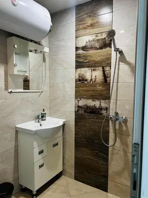 a bathroom with a sink and a shower at Classic Modern Apartment with Parking Place in Sofia