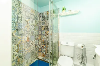 a bathroom with a toilet and a glass shower at The White Apartment 3BR - free parking in Sofia