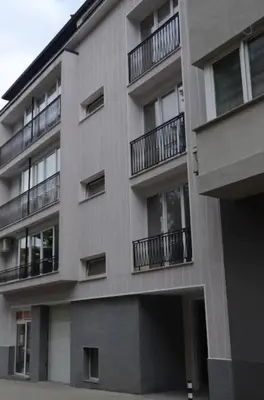 an apartment building with balconies on the side of it at Industrial Look Apartment Top Centre + Free Parking in Sofia