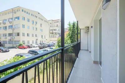 a balcony with a view of a parking lot at Quiet & airy modern apt. Top Centre Free Parking in Sofia