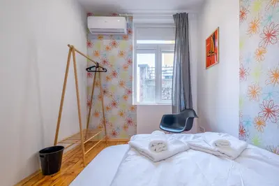 a bedroom with a bed with towels on it at Blue house Sofia Top Center 3BDR family & friends in Sofia