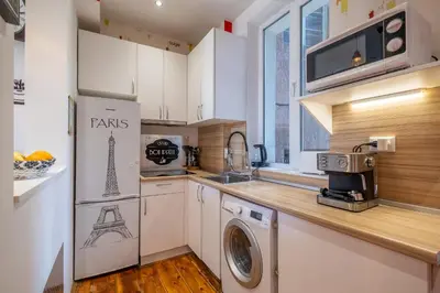 a kitchen with a refrigerator and a washing machine at Blue house Sofia Top Center 3BDR family & friends in Sofia