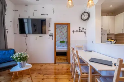 a kitchen and dining room with a table and chairs at Blue house Sofia Top Center 3BDR family & friends in Sofia