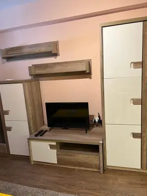 a room with a desk with a tv and a mirror at Guest House Amaya River in Plovdiv