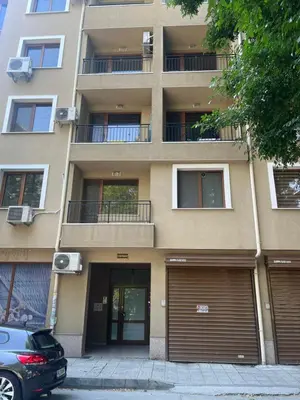 a building with two garage doors in front of it at Guest House Amaya River in Plovdiv