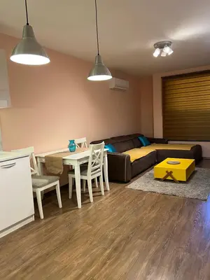 a living room with a couch and a table at Guest House Amaya River in Plovdiv