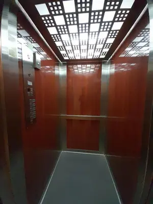 a elevator with a glass door and a ceiling at Ski-in ski-out Fantastic Apartament in Bansko