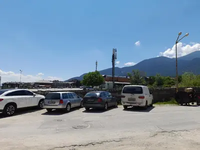 a group of cars parked in a parking lot at Ski-in ski-out Fantastic Apartament in Bansko