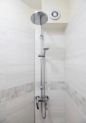 a shower with a glass door in a bathroom at Top Central Apartment & Free Parking in Sofia