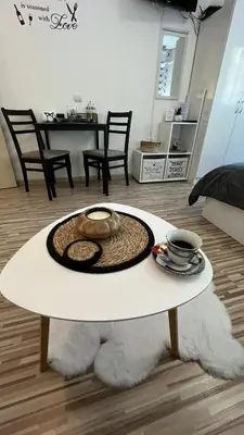 a coffee table with a hat on top of a living room at Studio John's in Blagoevgrad