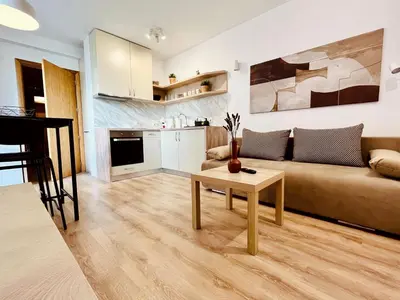a living room with a couch and a table at Apart-Hotels-Sofia, AHS in Sofia