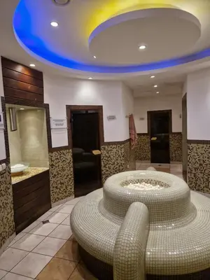a large bathroom with a large circular tub in a room at Green life, Bansko, private studio c-17 in Bansko