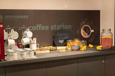 a counter with a coffee station with food on it at Maria Luisa by INTROVERT HOTELS in Sofia