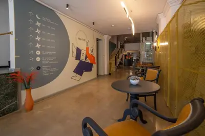 a restaurant with a table and a menu on the wall at Maria Luisa by INTROVERT HOTELS in Sofia