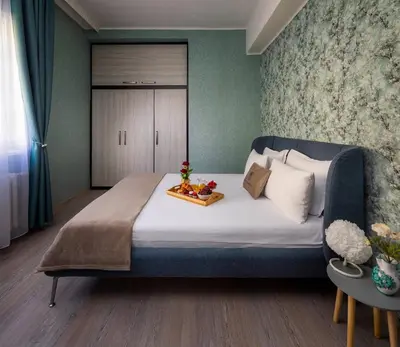 a bedroom with a bed with a tray of fruit on it at Free Parkingand Relax in Sofia