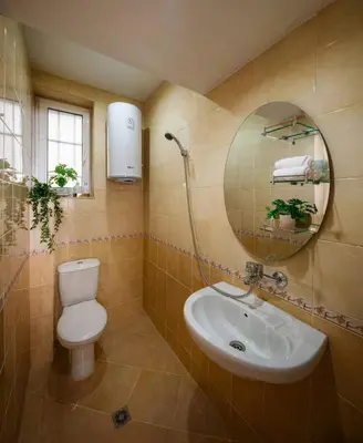 a bathroom with a toilet and a sink and a mirror at Free Parkingand Relax in Sofia