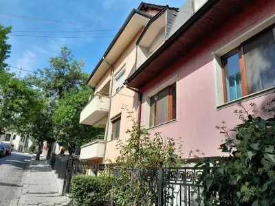 a pink house on the side of a street at VIEW hill plovdiv in Plovdiv