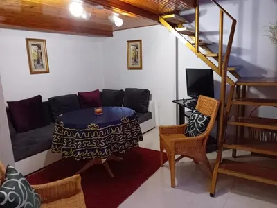a living room with a couch and a table at Апартамент Стела in Sofia