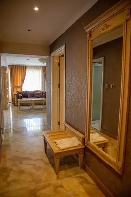 a room with a mirror and a table and a couch at Luxury Apartment Rich 2 in Velingrad