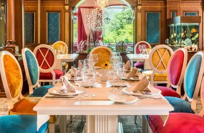 a dining room with a table and chairs at Luxury Apartment Rich 2 in Velingrad