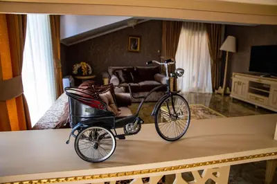 a bike with a baby carriage on top of a table at Luxury Apartment Rich 2 in Velingrad