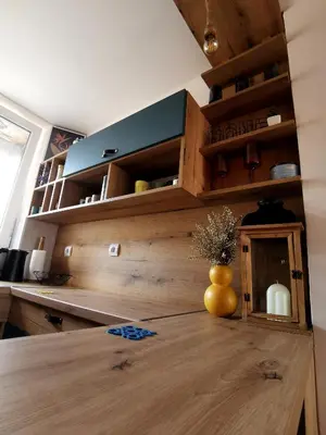 a kitchen with a wooden counter with a vase on a table at Rare view in Plovdiv