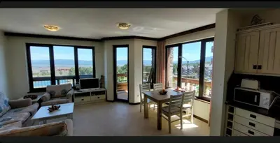 a living room with a couch and a table at ALL VIEW in Golf Resort in Razlog