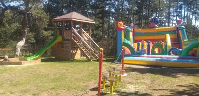 a playground with a slide and a play structure at ALL VIEW in Golf Resort in Razlog