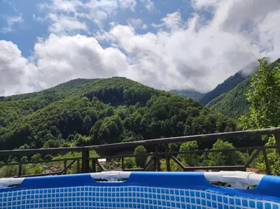 a view of the mountains from the top of a boat at Терасите - Къща 2 in Ribarica