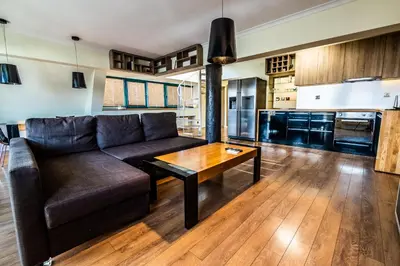 a living room with a couch and a table at On the top! in Sofia
