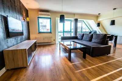 a living room with a couch and a tv at On the top! in Sofia