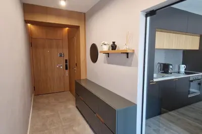 a kitchen with a counter and a door in a room at Mila's Cozy 1 Bedroom Apartment in Sofia