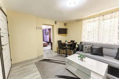 a living room with a couch and a table at Sweet Home 1 in Sandanski