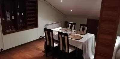 a dining room with a table and chairs with food on it at Classic Hotel in Sofia