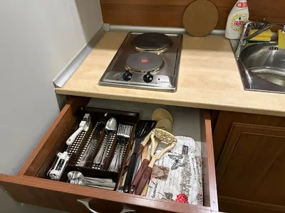 a drawer in a kitchen with a stove at Anna Apartment near Gondola in Bansko