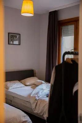 a bedroom with two beds and a window at Central Sofia 3-bedroom apartment - Urban Art gallery - Free Parking! in Sofia